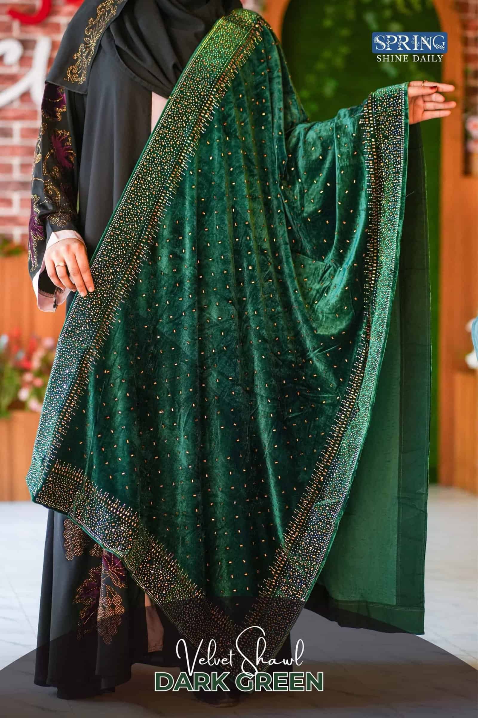 Elegant dark green velvet shawl with intricate embellishments, perfect for festive occasions.