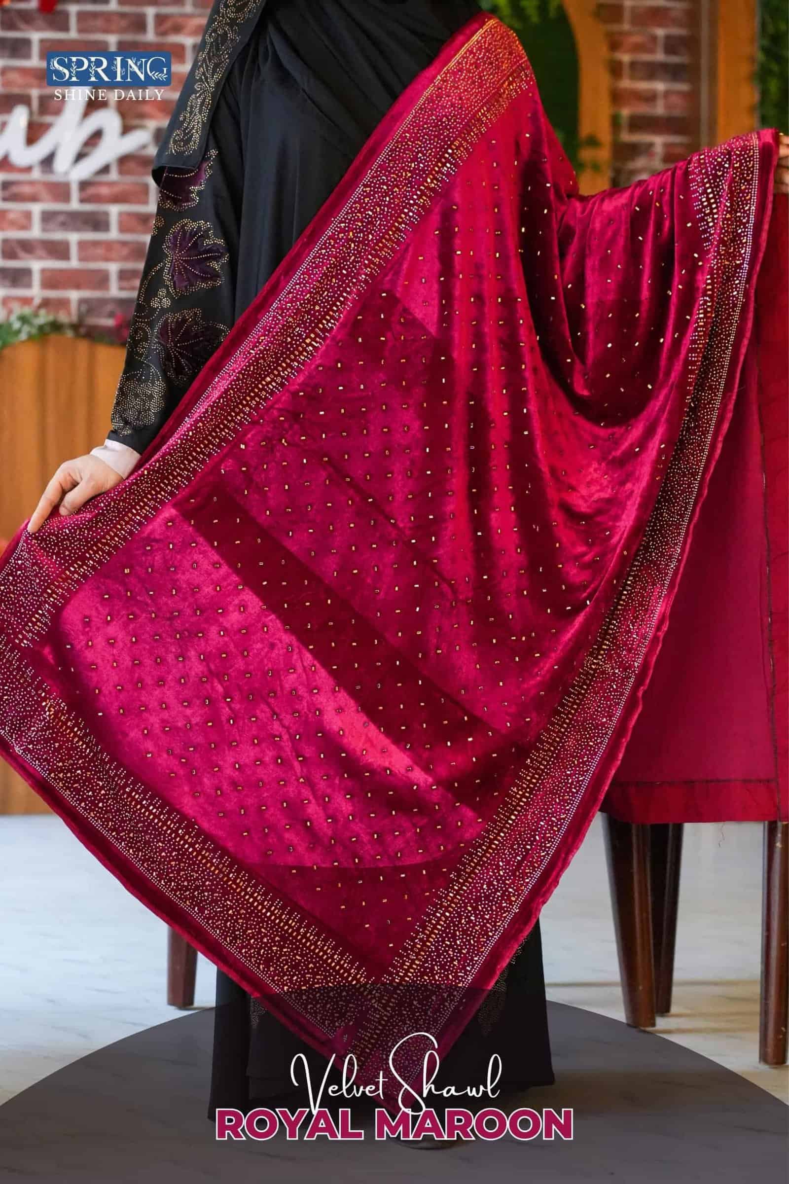 Luxurious velvet maroon shawl with gold accents and elegant design for traditional wear.